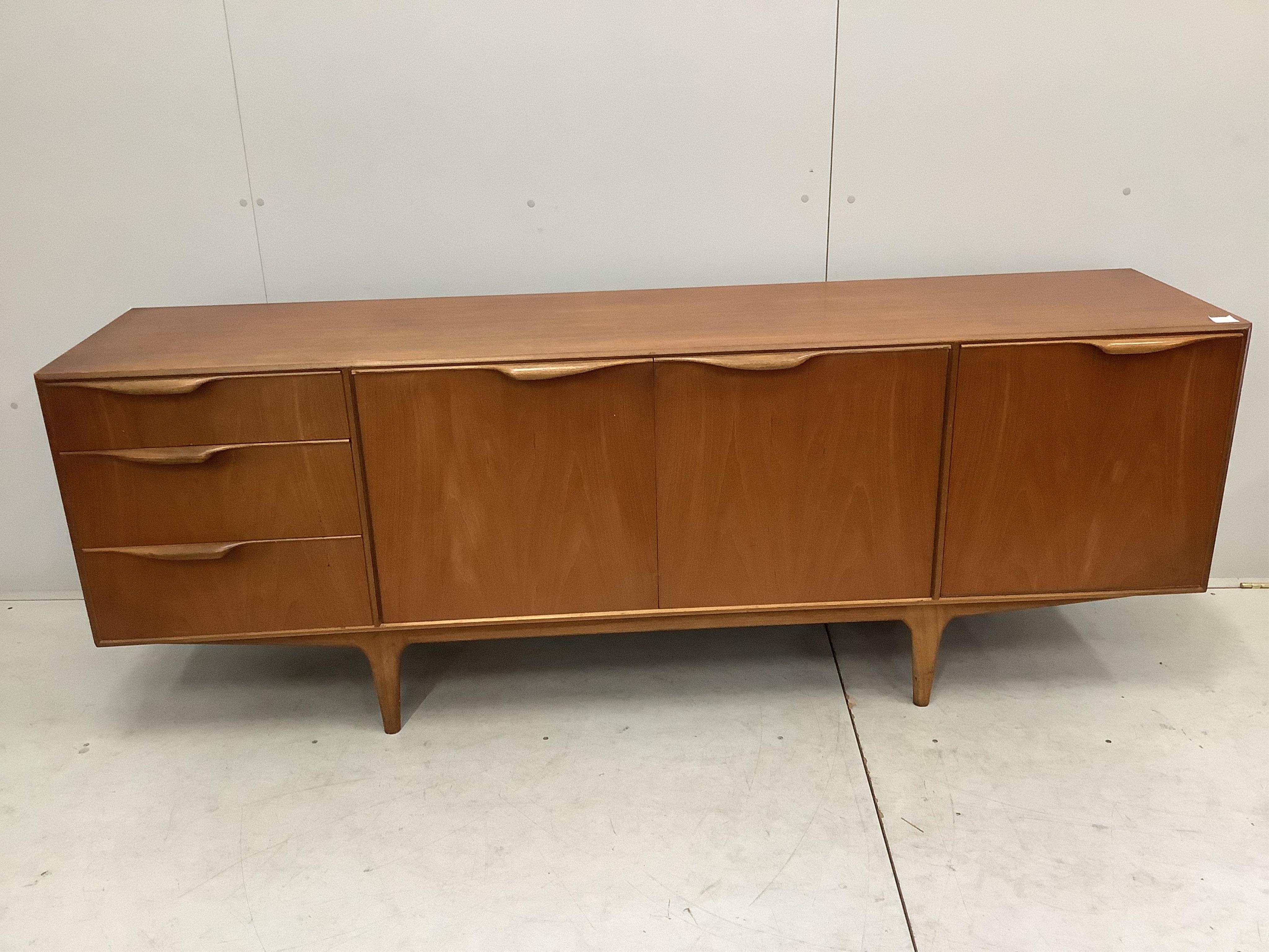 A mid century teak sideboard by A. Macintosh and Co., width 202cm, depth 47cm, height 74cm